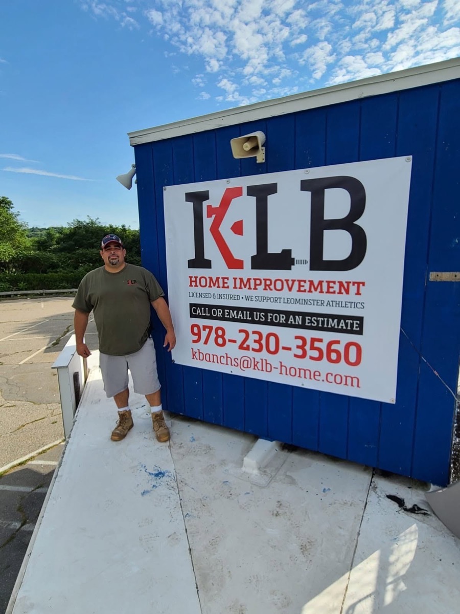 Kevin Banchs next to the KLB Home Improvement sign — licensed and insured, supporting Leominster athletics
